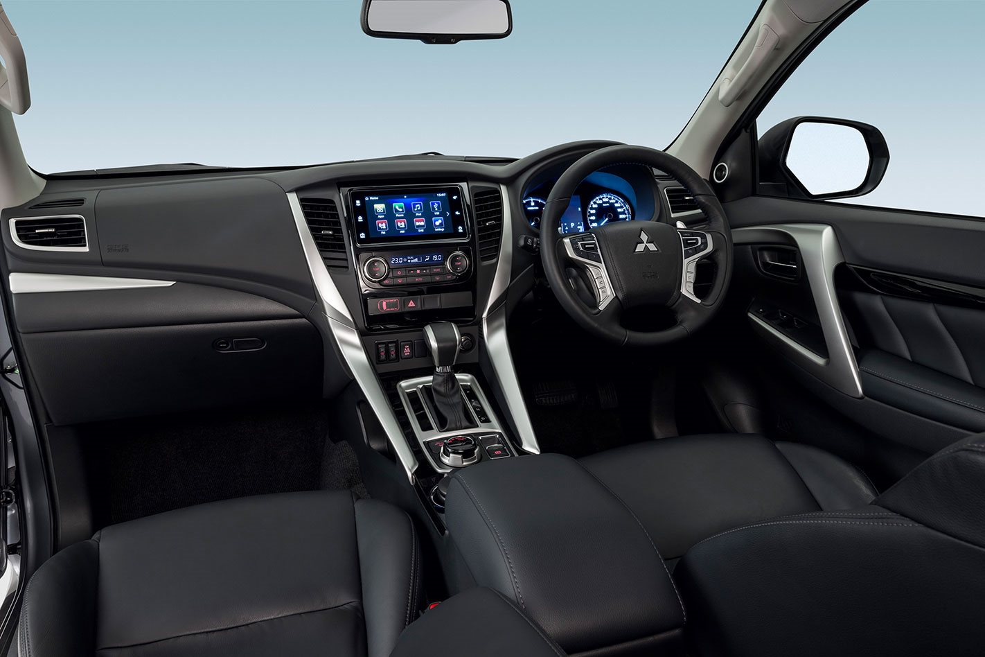 Mitsubishi Pajero Sport 2017 - inside the cabin, all-black interior. 